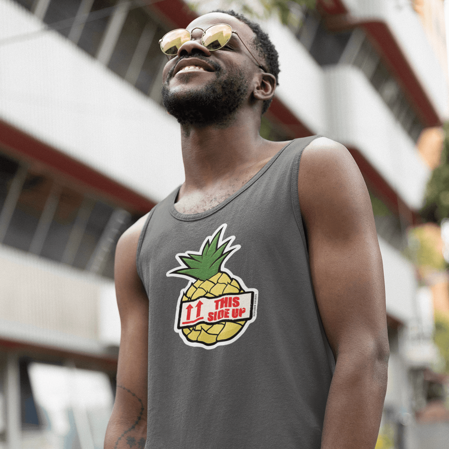 smiling man wearing cruise shirt and sunglasses in front of cruise ship