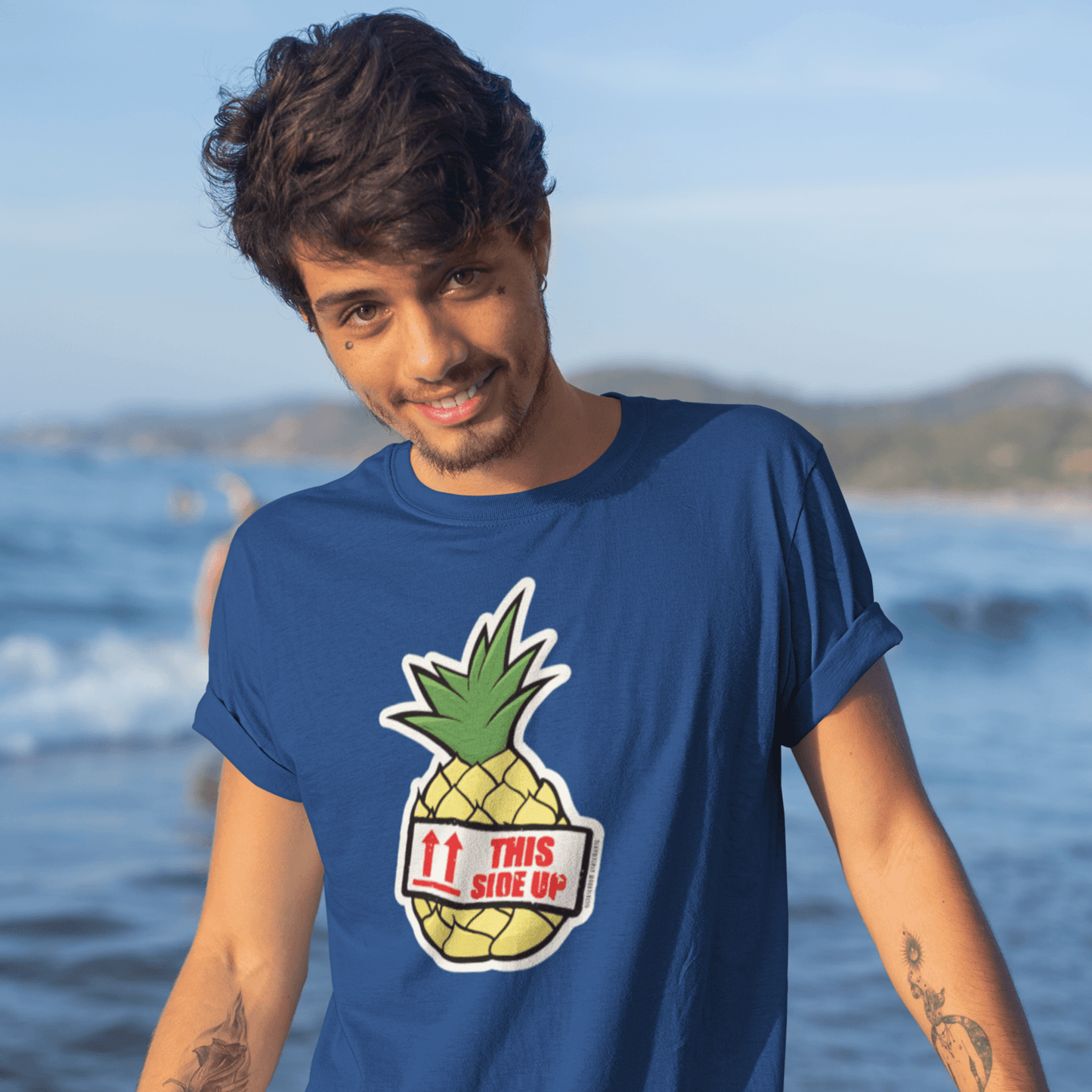 flirty man with tattoos wearing cruise shirt