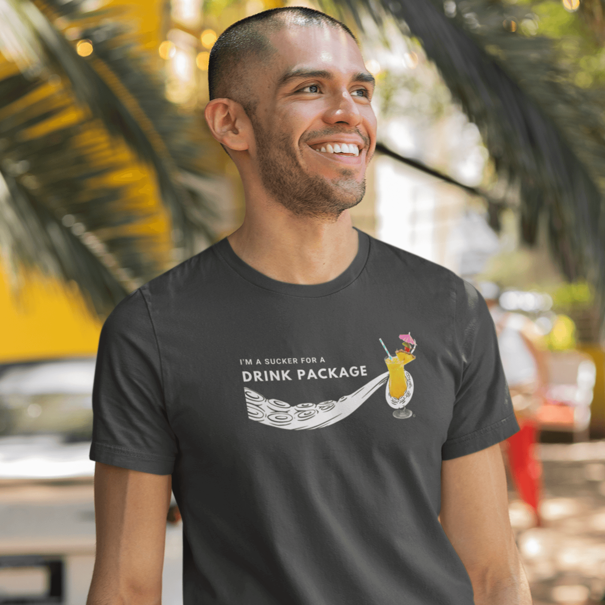 smiling man wearing cruise shirt